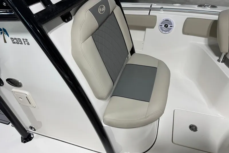 Slide: The Image of 2026 Key West 239 FS boat interior with cushioned seating and sleek design. - 9