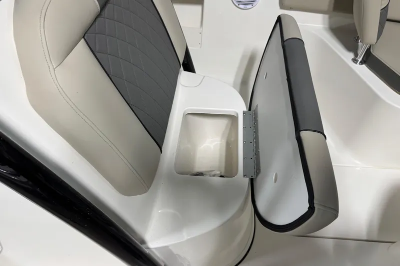 Slide: The Image of 2026 Key West 239 FS boat seat with open storage compartment. - 10