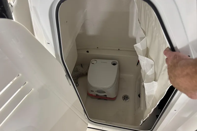 Slide: The Image of Interior of 2026 Key West 239 FS boat with portable toilet. - 11