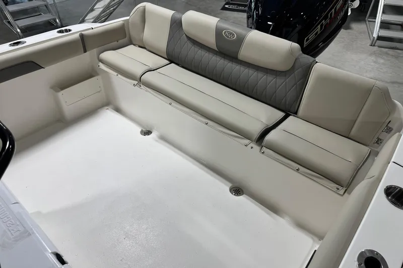 Slide: The Image of 2026 Key West 239 FS boat interior with cushioned seating and storage compartments. - 17