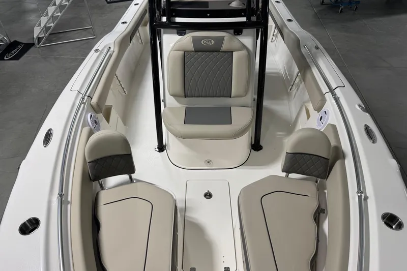 Slide: The Image of 2026 Key West 239 FS boat interior with cushioned seating and sleek design. - 5