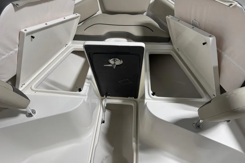 Slide: The Image of 2026 Key West 239 FS boat interior with open storage compartments. - 8