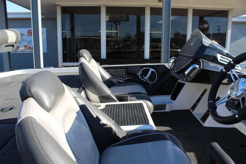 Slide: The Image of 2019 Ranger Z521 Comanche boat interior with sleek seats and modern dashboard. - 17