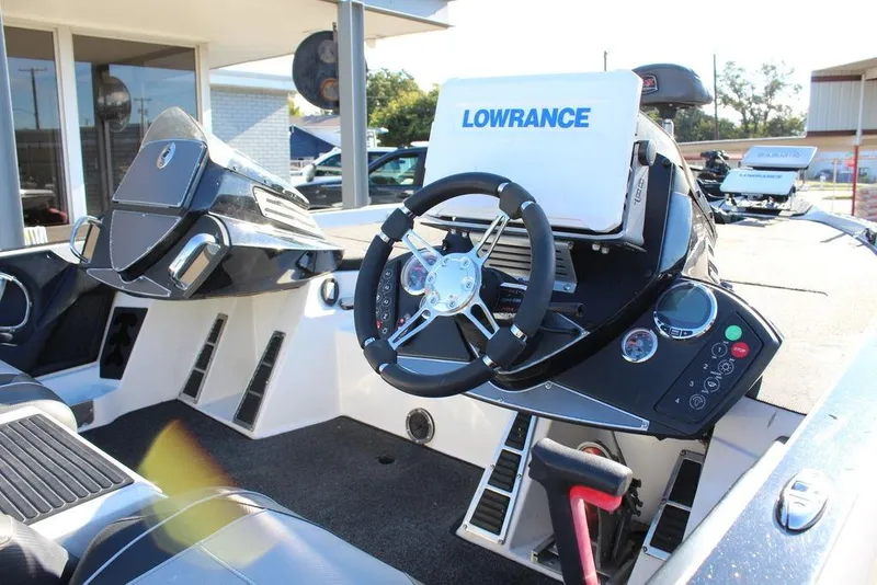 Slide: The Image of 2019 Ranger Z521 Comanche boat dashboard with Lowrance electronics and steering wheel. - 19