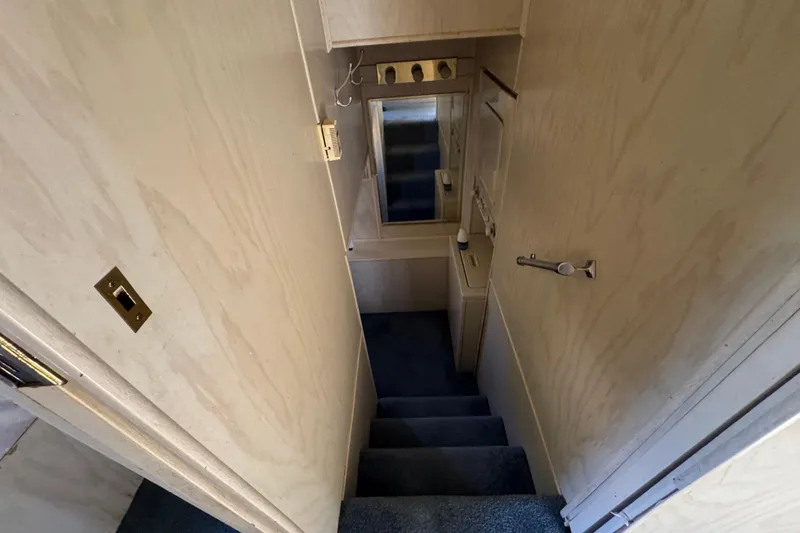 Slide: The Image of Narrow staircase with blue carpet in 1997 Monticello River Yacht interior. - 17