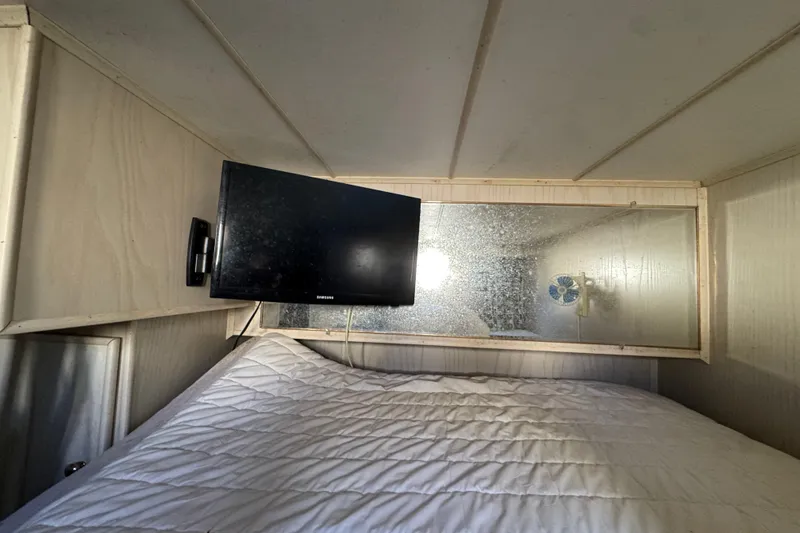 Slide: The Image of Cozy bedroom in 1997 Monticello River Yacht with TV and mirror. - 19