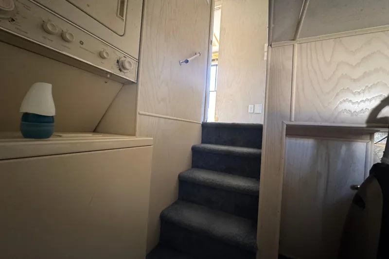 Slide: The Image of Interior of 1997 Monticello River Yacht with stairs and laundry area. - 22