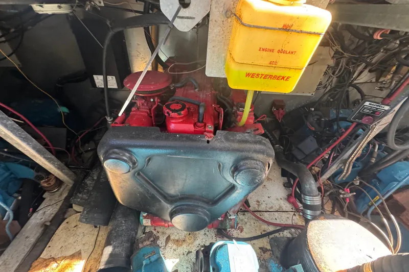 Slide: The Image of Engine room of a 1997 Monticello River Yacht, featuring a Westerbeke engine. - 25