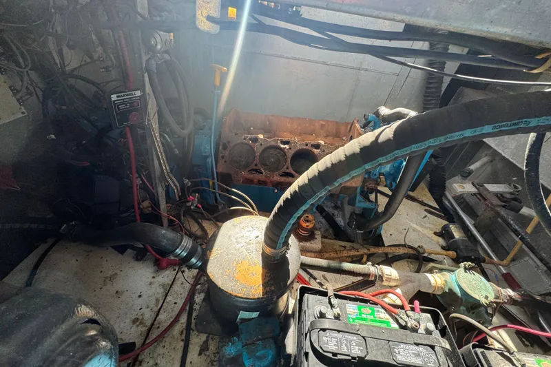 Slide: The Image of Engine room of a 1997 Monticello River Yacht, showing mechanical components and wiring. - 31