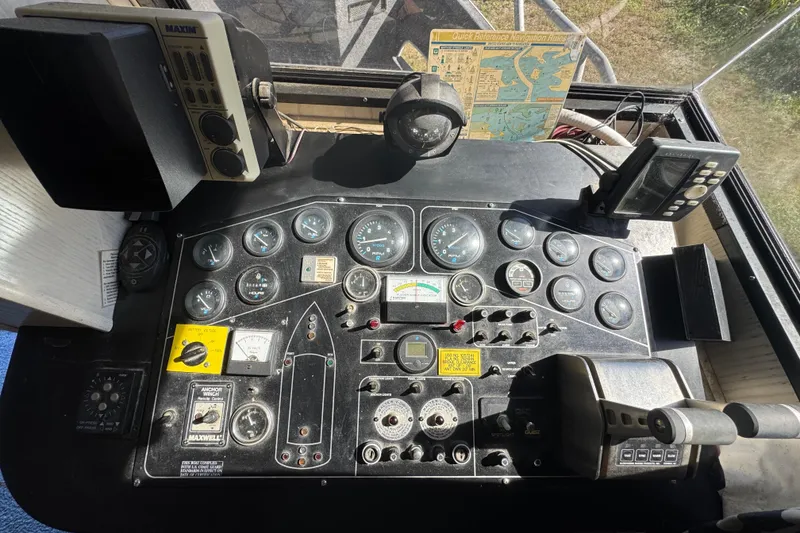 Slide: The Image of Control panel of a 1997 Monticello River Yacht, featuring gauges and navigation equipment. - 5