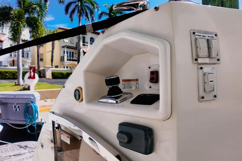 Slide: The Image of 2016 Sea Ray L590 Fly yacht docked at marina with American flag. - 18