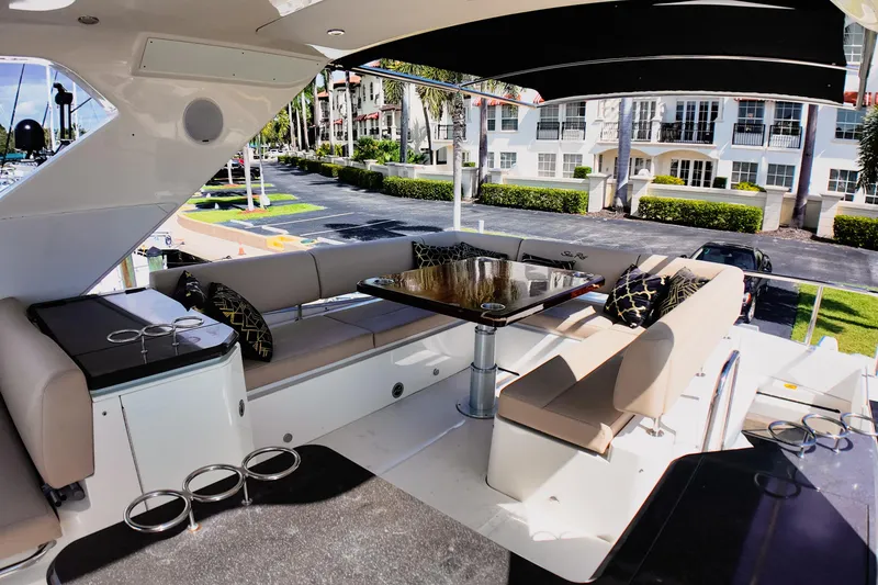 Slide: The Image of Control panel of 2016 Sea Ray L590 Fly yacht with switches and joystick. - 19