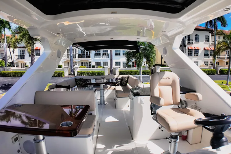 Slide: The Image of Luxurious 2016 Sea Ray L590 Fly yacht with elegant outdoor seating and dining area. - 20