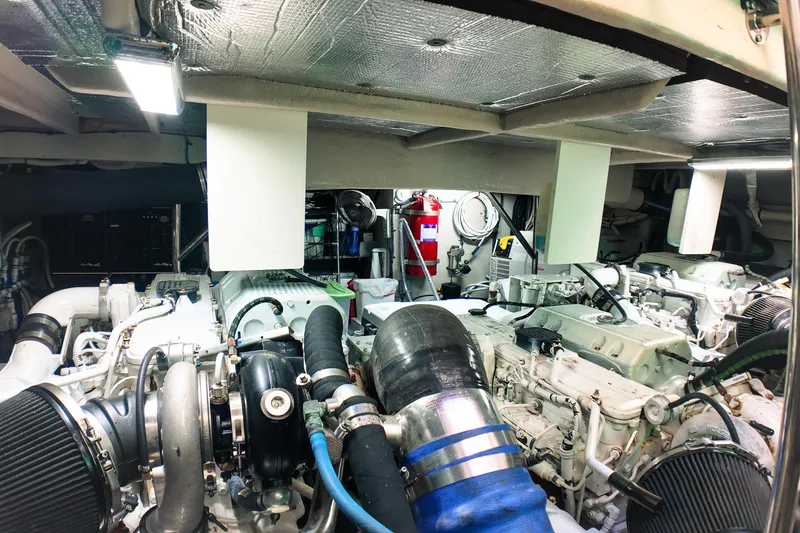 Slide: The Image of Engine room of a 2016 Sea Ray L590 Fly yacht, showcasing mechanical components and equipment. - 29