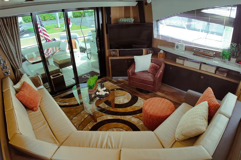 Slide: The Image of Luxurious 2016 Sea Ray L590 Fly yacht interior with helm, seating, and marina view. - 3