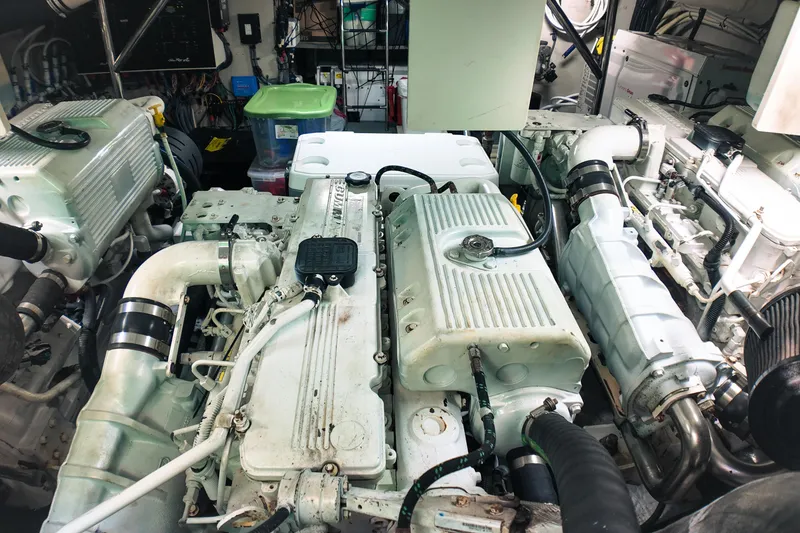 Slide: The Image of Engine room of a 2016 Sea Ray L590 Fly yacht, showcasing mechanical components. - 31