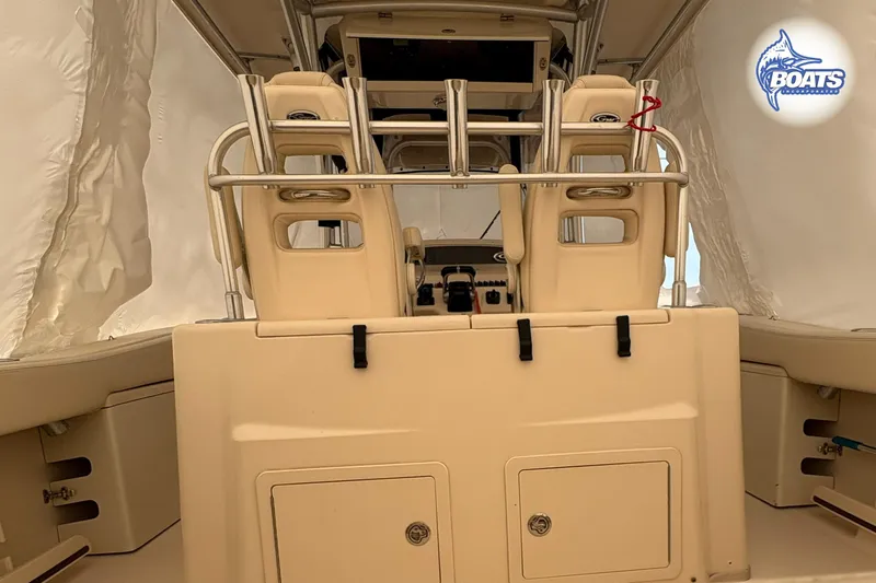 Slide: The Image of 2015 Grady-White Canyon 306 boat interior with helm seats and storage compartments. - 15