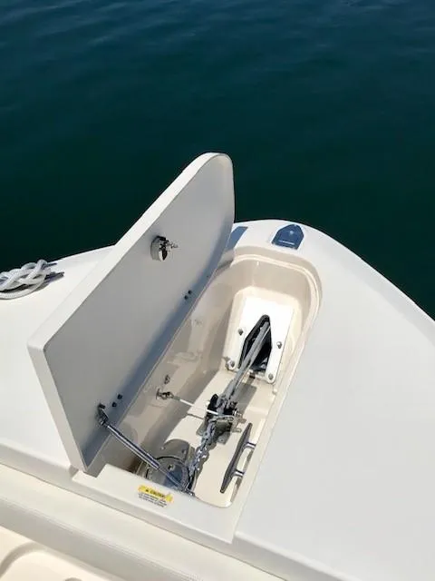 Slide: The Image of 2015 Grady-White Canyon 306 anchor compartment on calm water. - 20