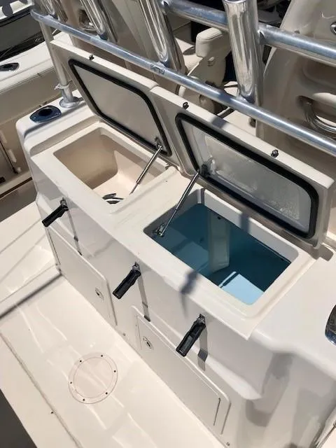 Slide: The Image of 2015 Grady-White Canyon 306 boat with dual livewells and storage compartments. - 23
