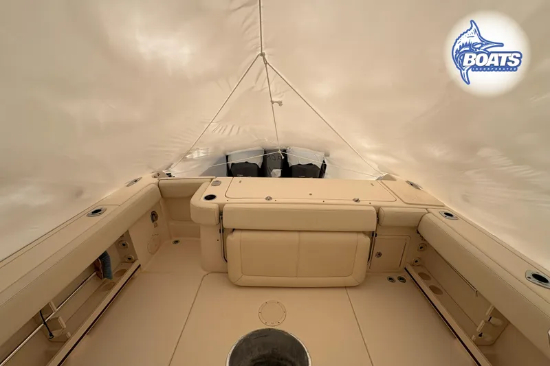 Slide: The Image of 2015 Grady-White Canyon 306 boat interior under protective cover. - 26
