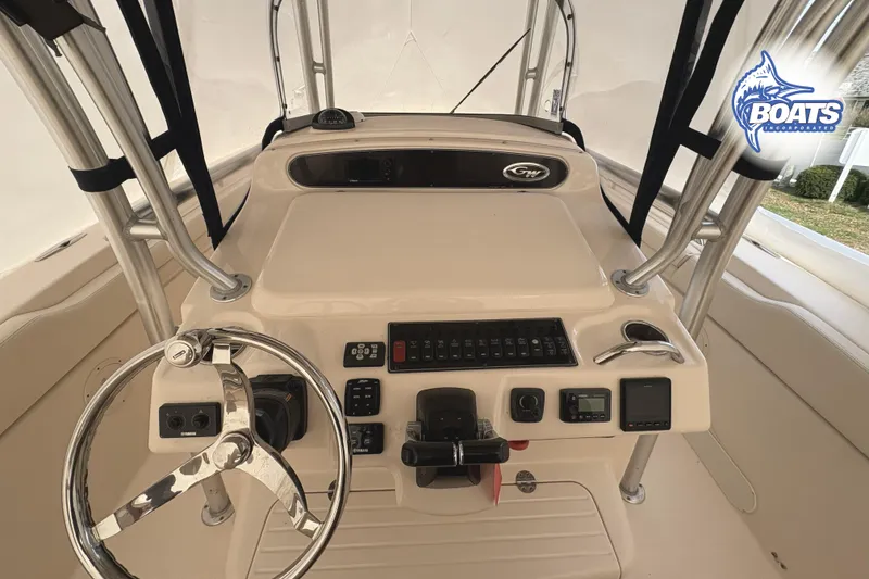 Slide: The Image of 2015 Grady-White Canyon 306 boat helm with steering wheel and control panel. - 7