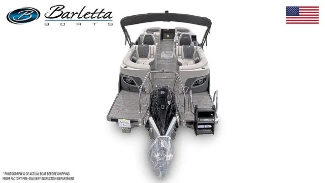 Slide: The Image of 2025 Barletta Corsa 23QCSS boat, top view, sleek design, luxury seating, American flag. - 6