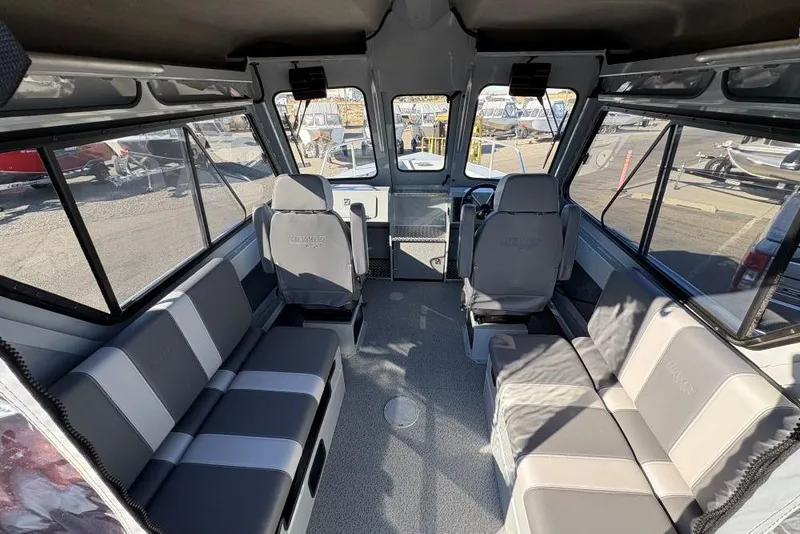 Slide: The Image of Interior of 2025 Hewescraft 220 Ocean Pro ET HT boat, featuring spacious seating and modern design. - 3