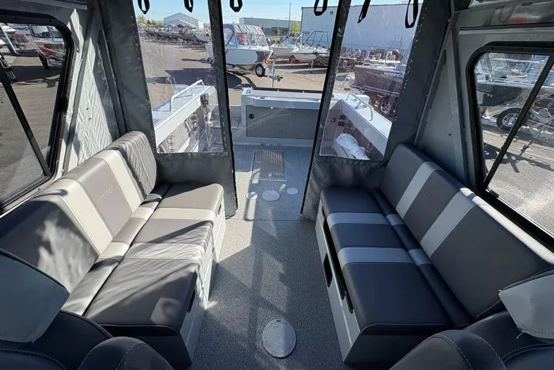 Slide: The Image of Interior of 2025 Hewescraft 220 Ocean Pro ET HT boat with seating and windows. - 5