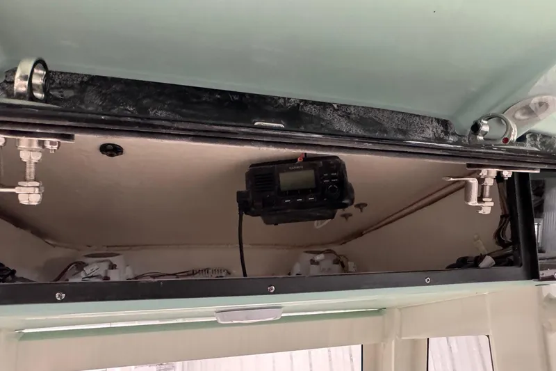 Slide: The Image of 2026 Key West 239 FSR boat interior with mounted Garmin radio equipment. - 13