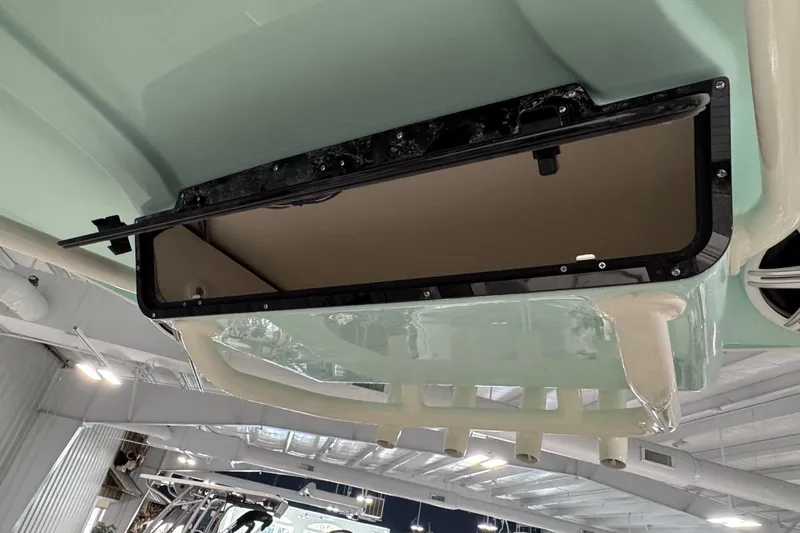 Slide: The Image of 2026 Key West 239 FSR boat storage compartment, open view in indoor setting. - 14
