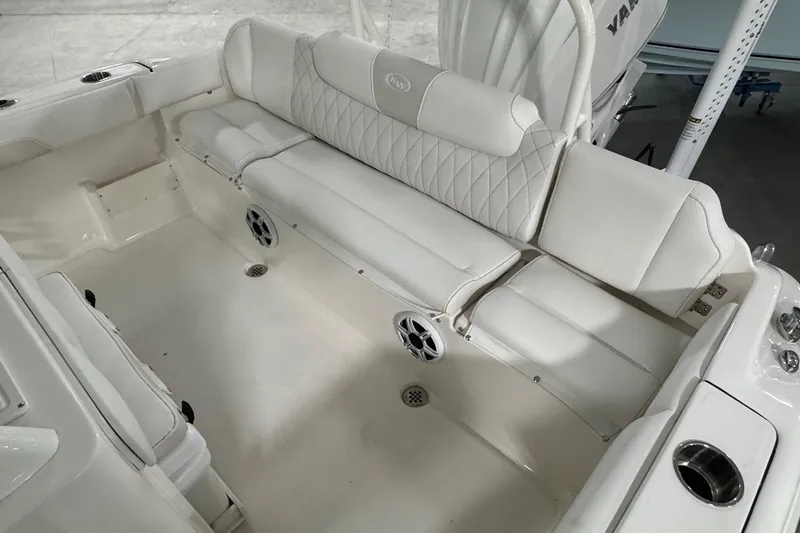 Slide: The Image of Luxurious seating in 2026 Key West 239 FSR boat, featuring white upholstery and built-in speakers. - 17