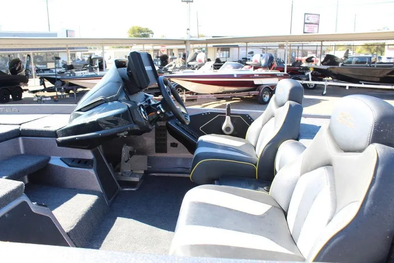 Slide: The Image of 2019 Skeeter ZX225 boat interior with dual seats and steering console. - 17