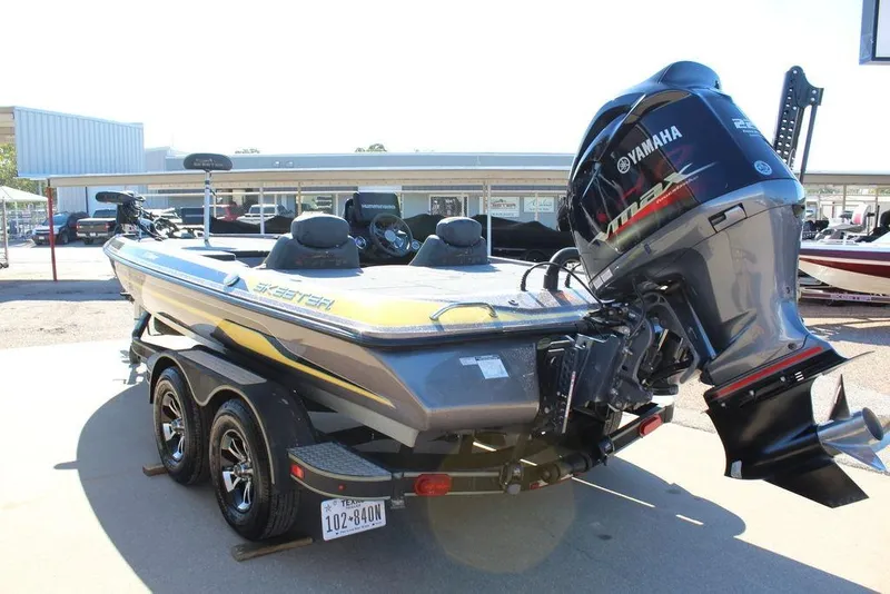 Slide: The Image of 2019 Skeeter ZX225 boat with Yamaha engine on a trailer in a dealership lot. - 3