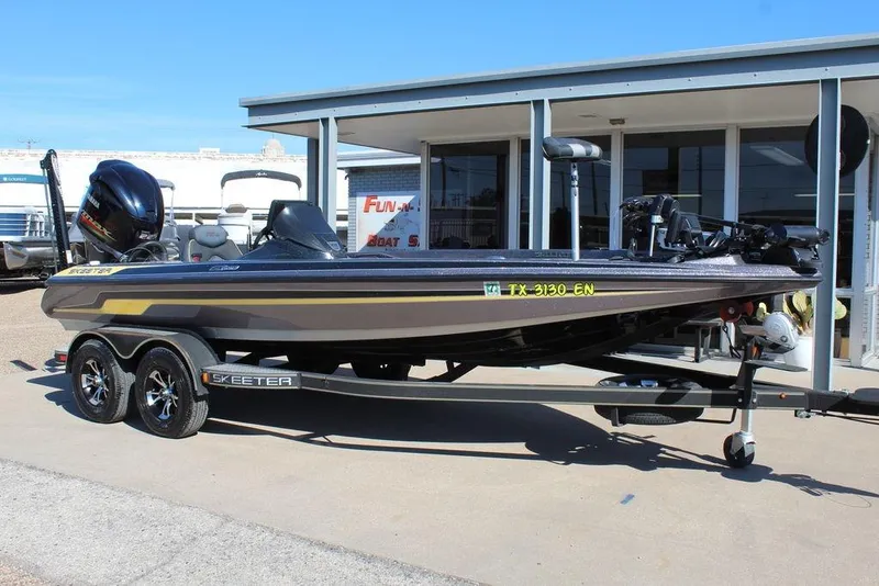 Slide: The Image of 2019 Skeeter ZX225 bass boat on trailer, parked outside dealership. - 4