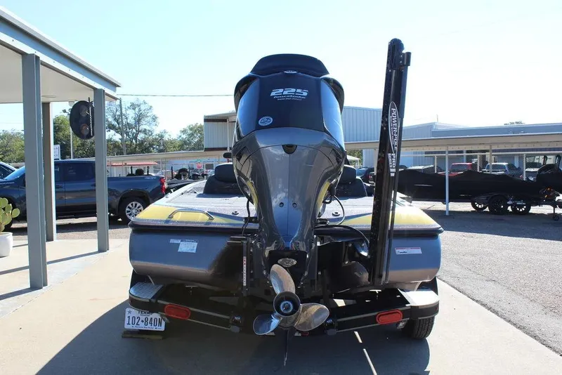 Slide: The Image of 2019 Skeeter ZX225 boat rear view with motor and trailer in parking lot. - 5