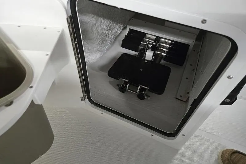 Slide: The Image of Storage compartment in 2026 Sea Hunt Ultra 245 SE boat interior. - 13