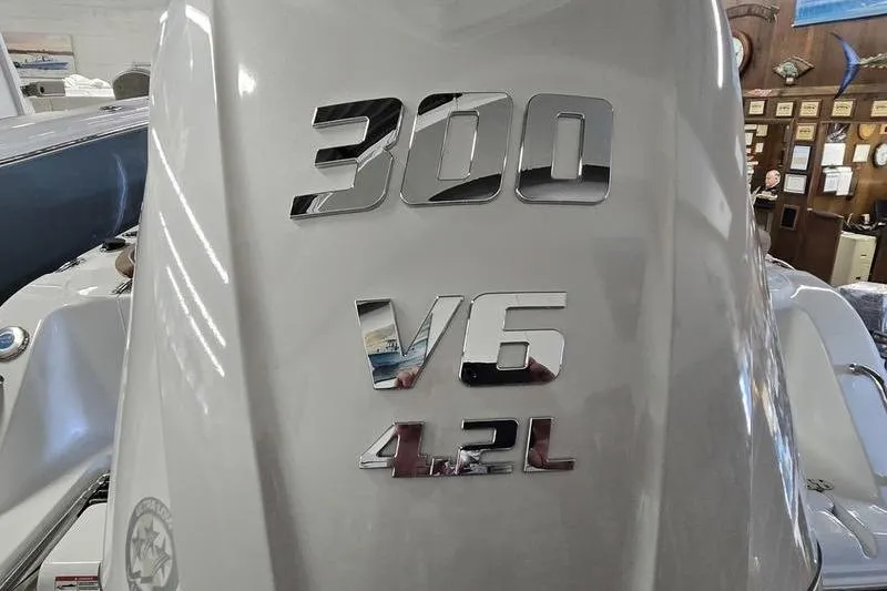 Slide: The Image of Sea Hunt Ultra 245 SE 2026 boat engine, 300 V6 4.2L, close-up view. - 6