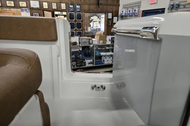 Slide: The Image of Interior view of 2026 Sea Hunt Ultra 245 SE boat, showcasing seating and storage. - 7