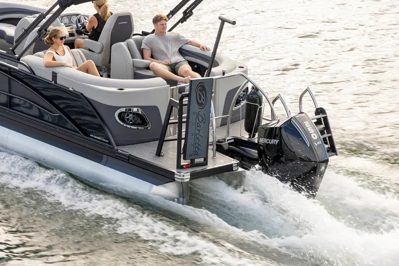 Slide: The Image of 2025 Barletta Corsa 23U pontoon boat cruising with passengers on a sunny day. - 9