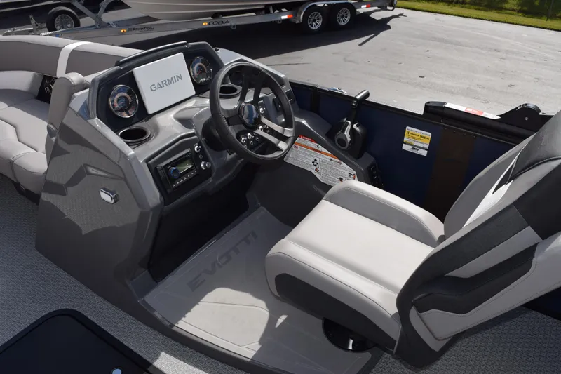Slide: The Image of 2026 Evotti 521 CS boat cockpit with Garmin navigation system and modern steering console. - 13