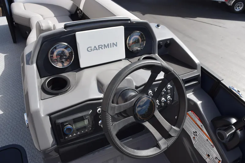 Slide: The Image of 2026 Evotti 521 CS boat dashboard with Garmin navigation system and steering wheel. - 14