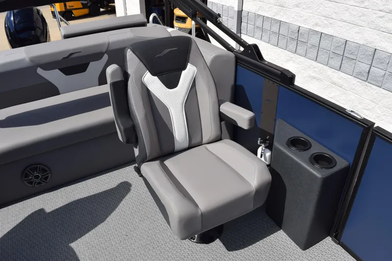 Slide: The Image of Gray seating area on 2026 Evotti 521 CS boat with cup holders and armrests. - 17