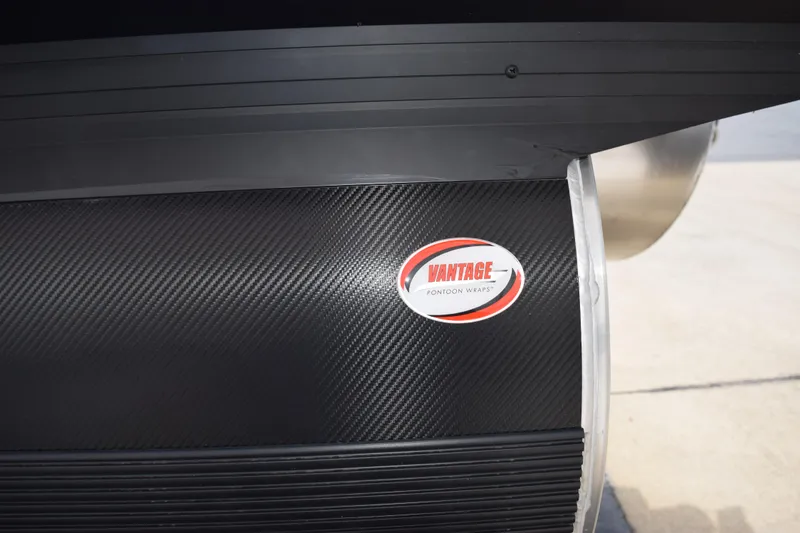 Slide: The Image of Evotti 521 CS 2026 with Vantage pontoon wrap, featuring carbon fiber texture. - 7