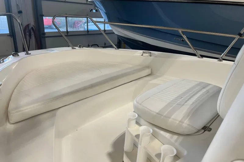 Slide: The Image of 2012 Boston Whaler 180 Dauntless boat console with steering wheel and navigation instruments. - 5