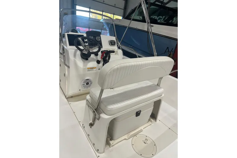 Slide: The Image of Boston Whaler 180 Dauntless 2012 boat interior with cooler storage under seat. - 7