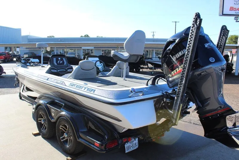 Slide: The Image of 2016 Skeeter FX21 Limited Edition boat with Yamaha engine, parked on a trailer. - 10