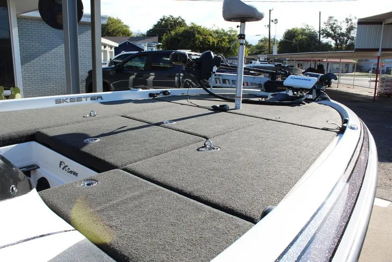Slide: The Image of 2016 Skeeter FX21 Limited Edition boat with spacious deck and fishing equipment. - 13
