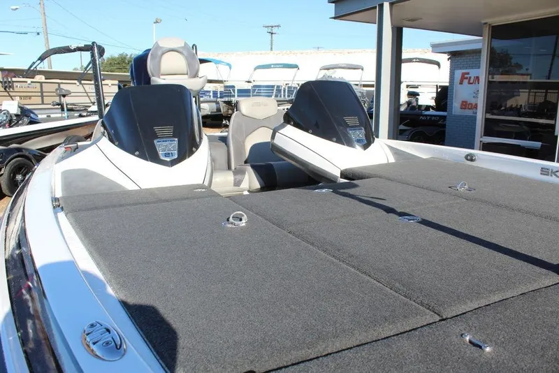Slide: The Image of 2016 Skeeter FX21 Limited Edition boat with spacious deck and dual consoles. - 14