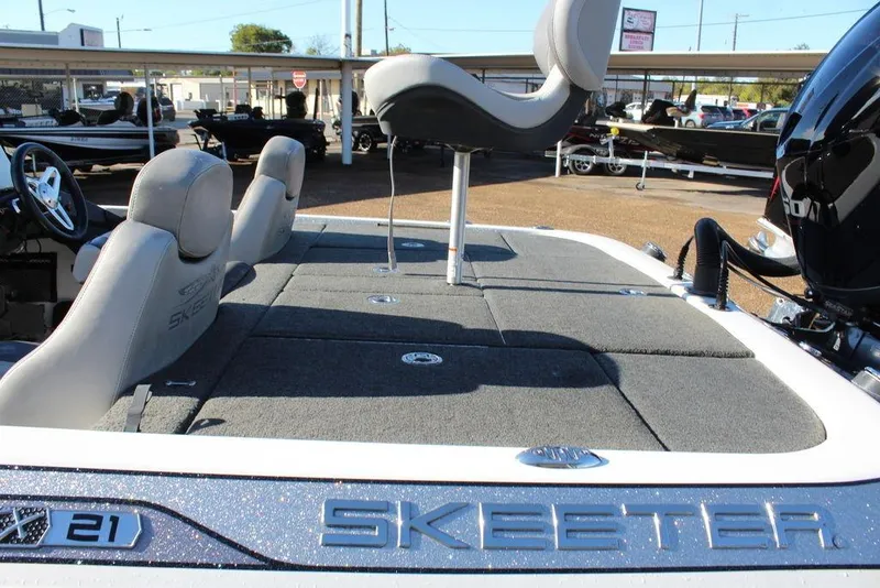 Slide: The Image of 2016 Skeeter FX21 Limited Edition boat interior with seating and deck view. - 16