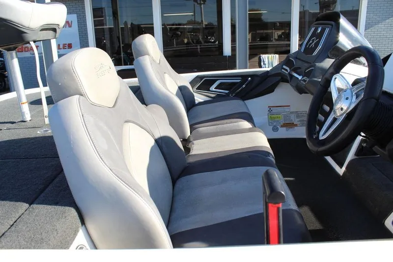 Slide: The Image of 2016 Skeeter FX21 Limited Edition boat interior with gray seating and steering wheel. - 18